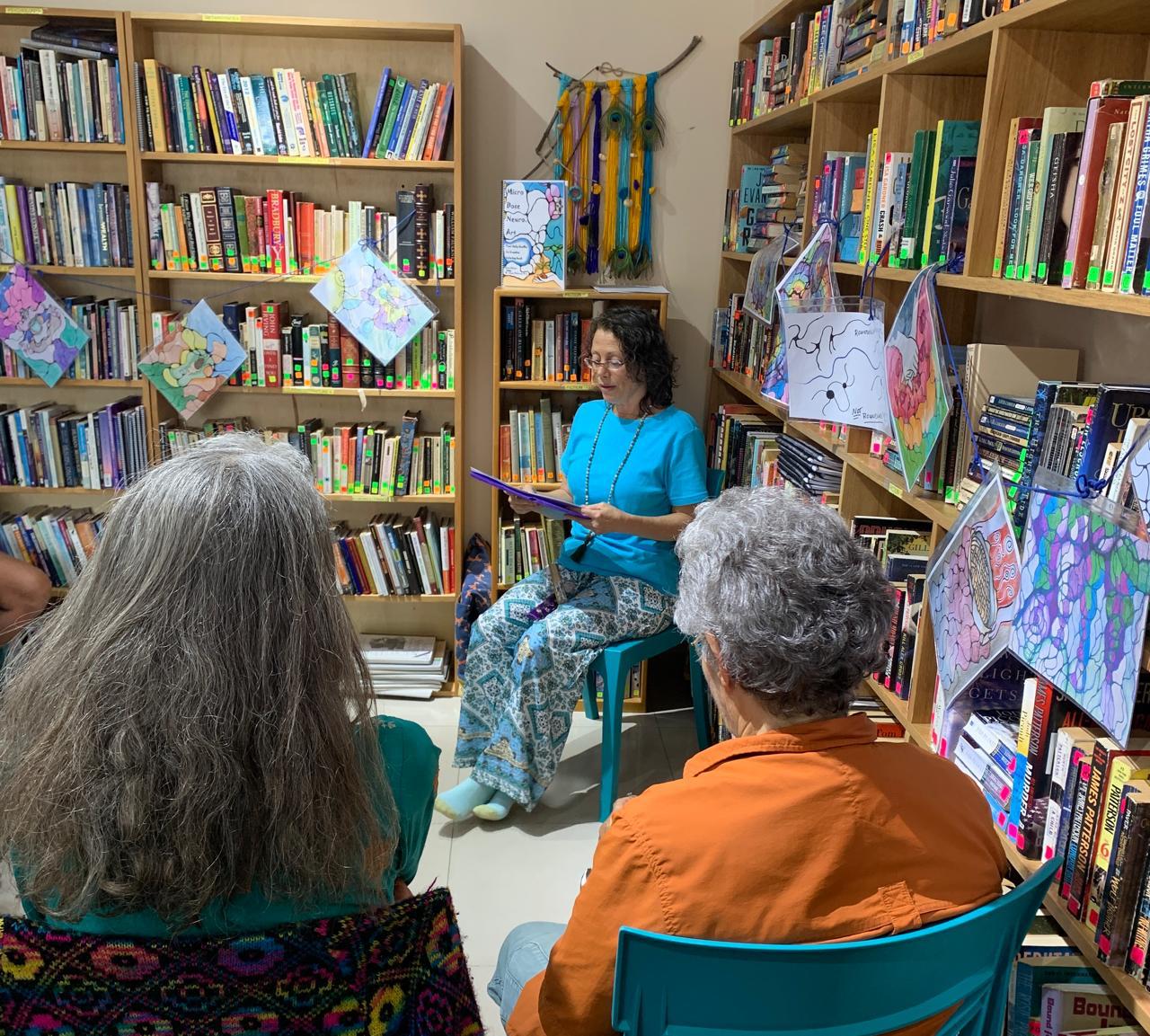 Participants in a Microdose Neuro Art class rounding intersections on coloring pages