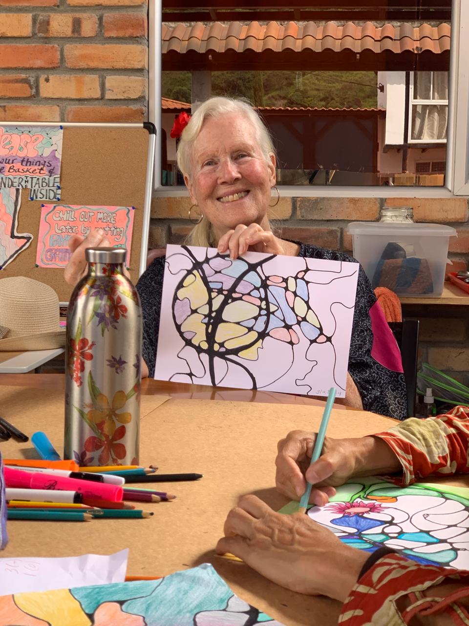 Close-up of a student coloring a Microdose Neuro Art page